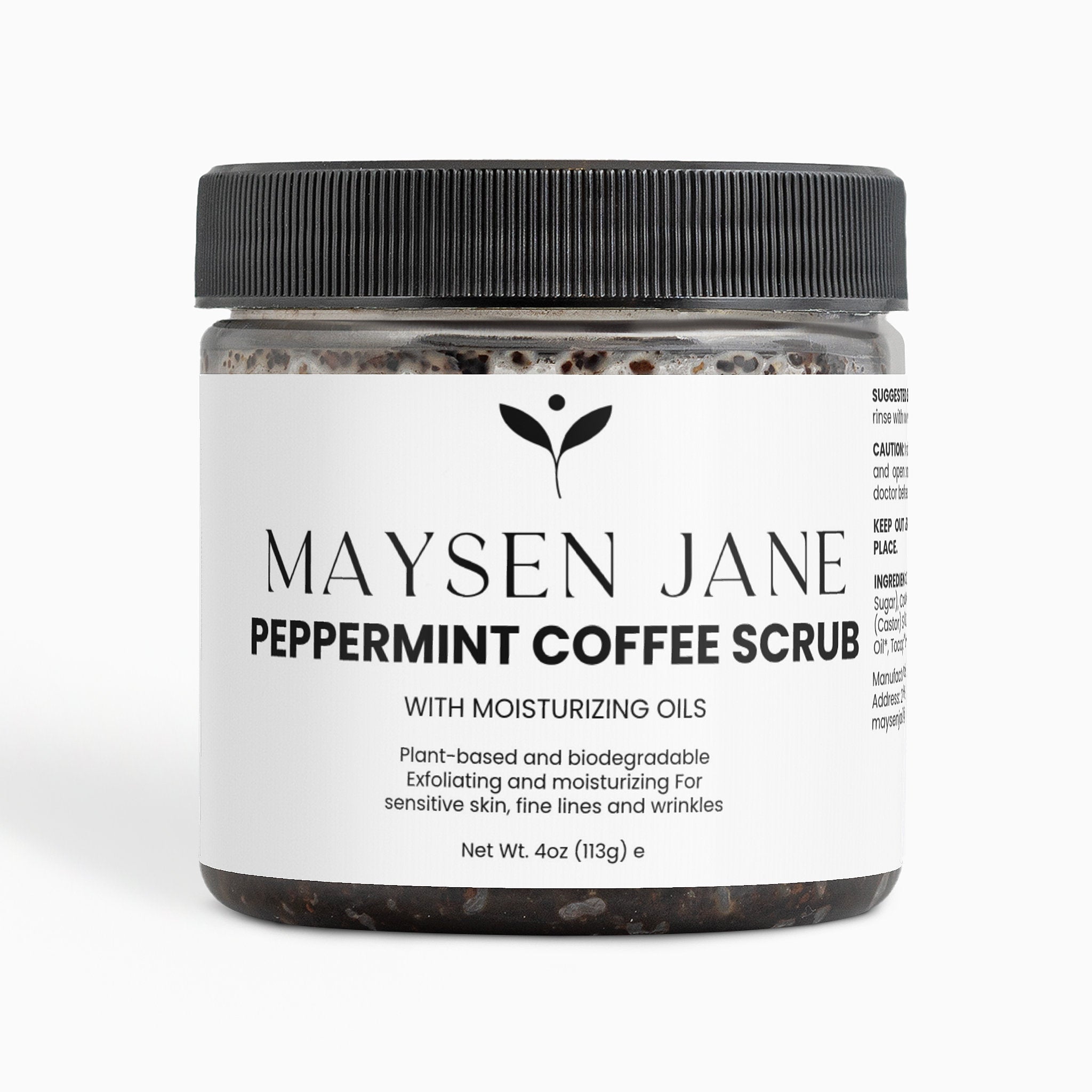 A jar of Maysen Jane Peppermint Coffee Scrub with moisturizing oils, featuring a black ribbed lid and a white label with black text, set against a plain white background.